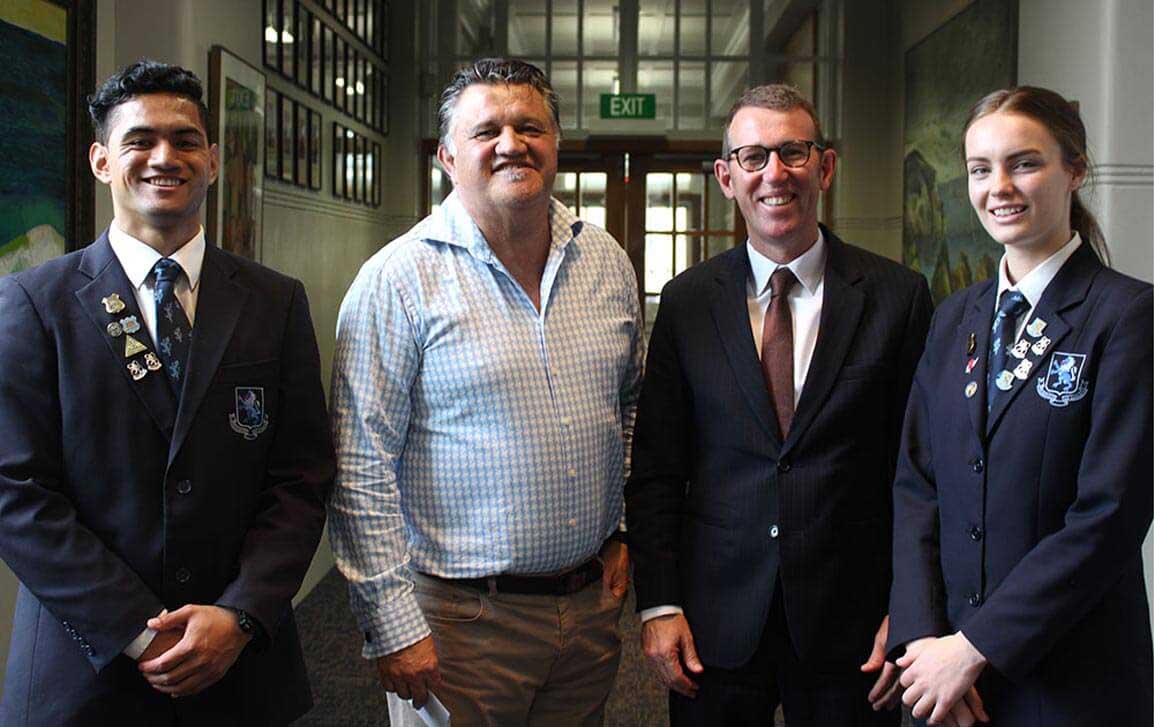 MAGS head boy Denzel Robertson and head girl Jaimee McLaughlan wsith headmaster Patrick Drumm and actor comedian Pio Terei at a special assembly